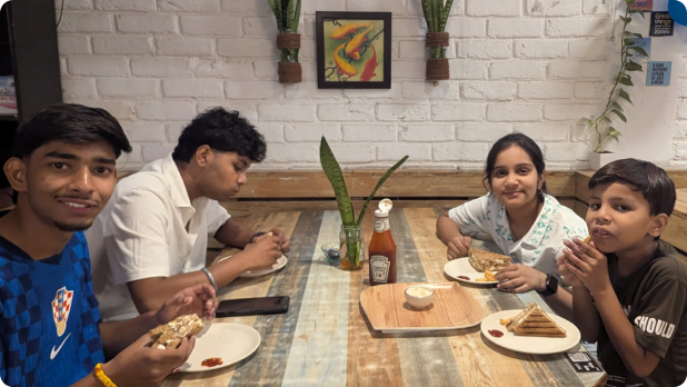 Friends enjoying sandwiches and snacks at Pepper Pot Café