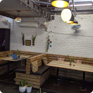 Cozy wooden seating nook on the Pepper Pot Café terrace
